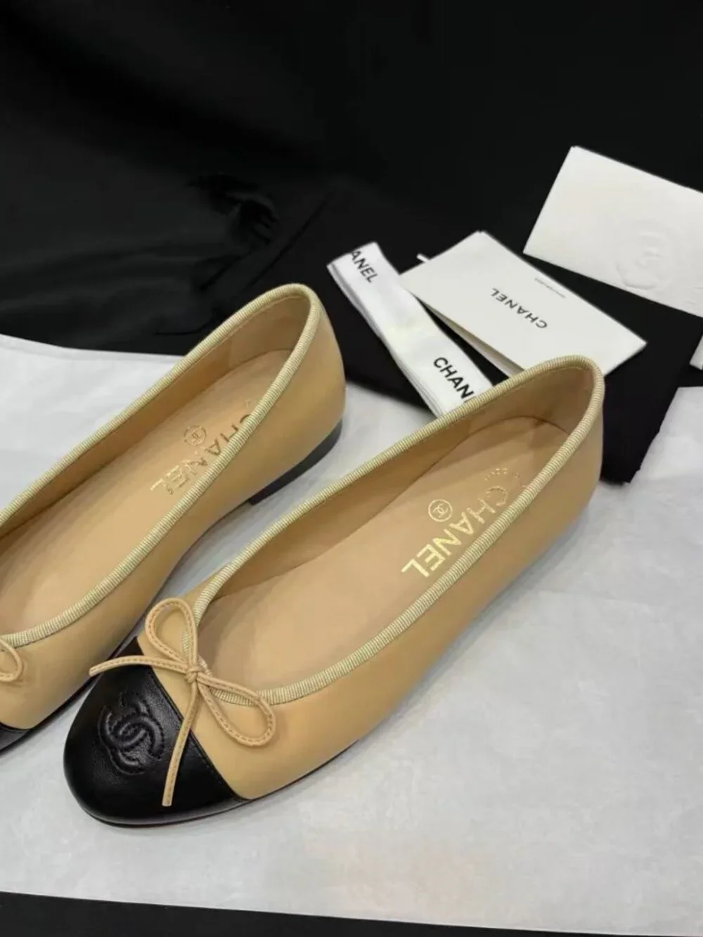 CHANEL Two‑Tone Bow‑Trim Leather Round‑Toe Ballet Flats